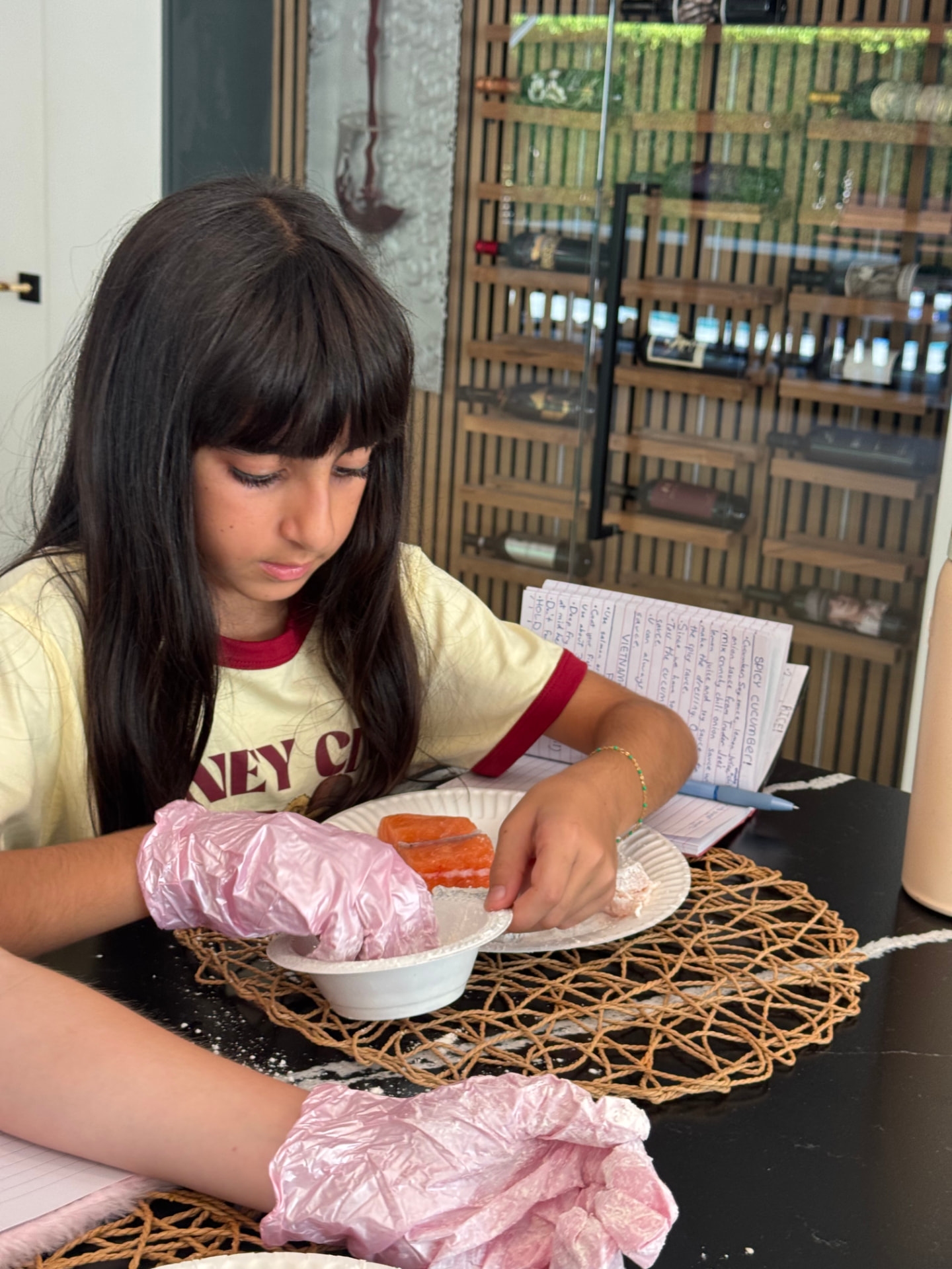 Young cook coating a dessert with powdered sugar